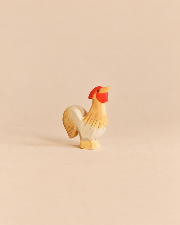 Handcrafted Ostheimer Rooster - Ochre wooden figurine with a red comb and wattle.