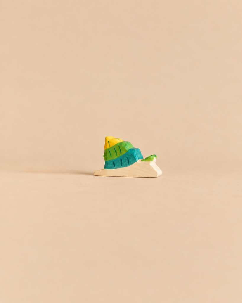 Holztiger Snail handcrafted wooden toy with a yellow and green shell.