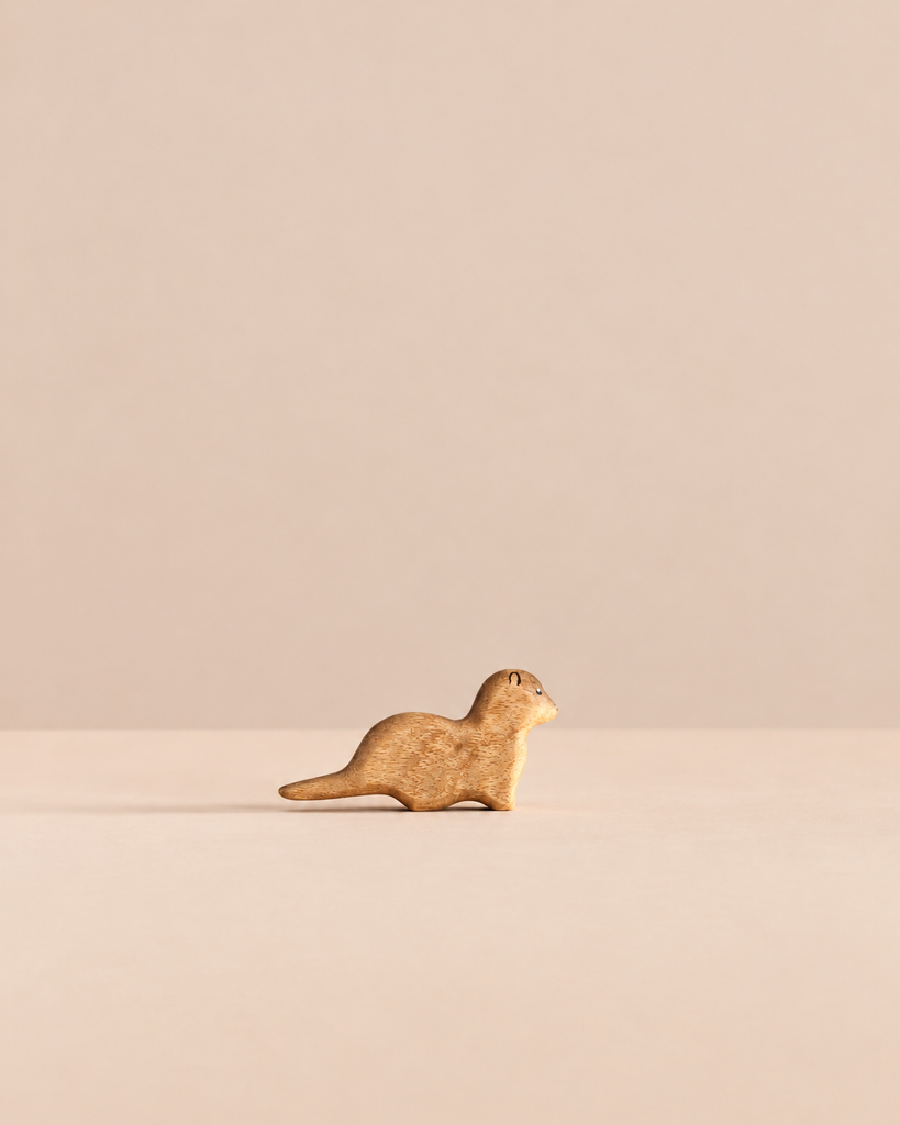Handmade Holzwald Small Otter wooden figurine, an ideal choice for sustainable toys.