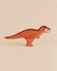 Handmade Holzwald Dinosaur - T-Rex Maroon, a maroon-painted wooden toy with visible teeth, crafted as a sustainable toy.