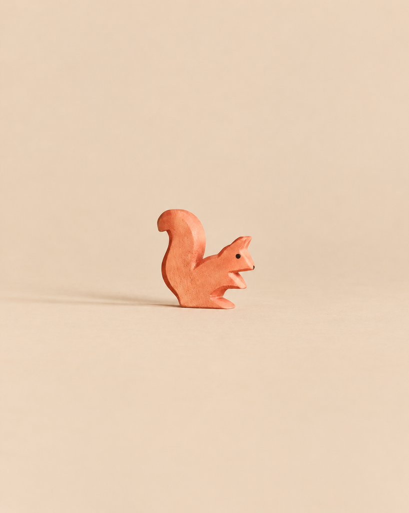 Small, handcrafted wooden Ostheimer Squirrel - Sitting in a sitting position.