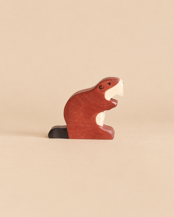 Handcrafted wooden Holztiger Beaver figurine shown in profile.