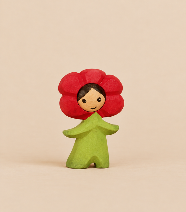 Bumbu Handmade Wooden Flower Child Poppy, a Waldorf wooden figurine of a child wearing a red poppy flower hat and a green leafy outfit, perfect for small world play.