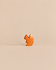 Handmade Holzwald Small Squirrel figurine featuring orange fur and a cream-colored tail tip, crafted as a sustainable wooden toy.