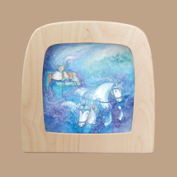 The "Silhouette Only - Ice Queen Silhouette for Toverlux Lamp" features a graceful silhouette of an Ice Queen in a chariot with two white horses, set amid swirling blue and purple mist.