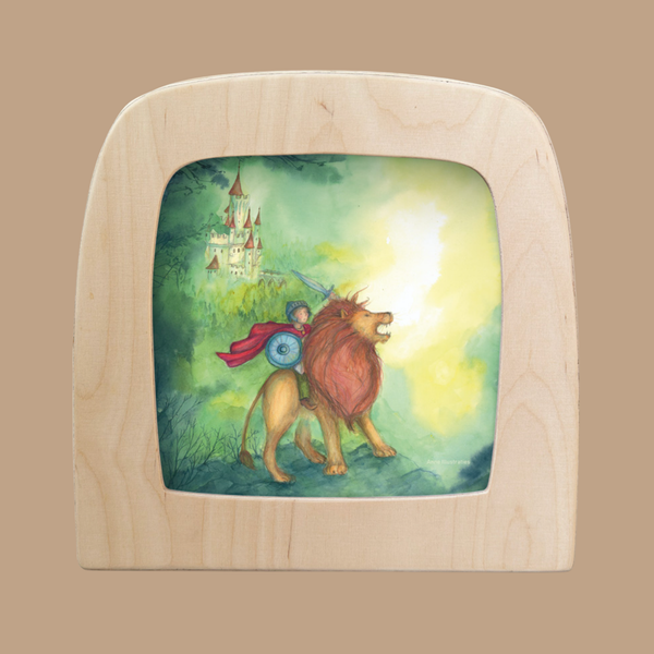 The Knight Silhouette for Toverlux Lamp depicts a knight riding a lion toward a distant castle amid greenery and mist, capturing the magical essence of Magic Silhouettes.
