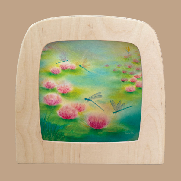 A "Silhouette Only - Dragonfly Silhouette for Toverlux Lamp" shows blue and yellow dragonflies above pink water lilies in a green pond, creating a soft, dreamy scene when displayed in a wooden Toverlux frame.