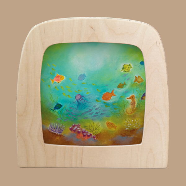 The Silhouette Only - Underwater World for Toverlux Lamp features vibrant fish, a jellyfish, seahorse, and coral on a wooden frame with a green-blue gradient background evoking the magic of the ocean floor.