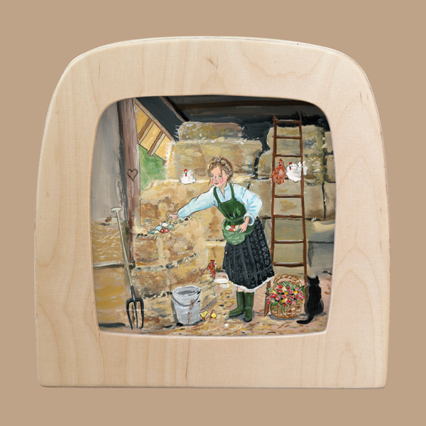 The Silhouette Only - Barn Life for Toverlux Lamp features a woman feeding chickens in a barn, with a bowl, scattered feed, black cat, ladder, pitchfork, buckets, straw and stone walls depicted in this charming scene.