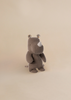 The Maileg Small Rhino - Chocolate, part of the Safari Friends collection, is a brown plush toy with a small horn, round patterned ears, soft fabric, and stitched features, shown standing on a light beige background.
