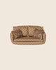 Maileg Christmas Living Room Set sofa featuring a repeating flower pattern with two matching decorative throw pillows.
