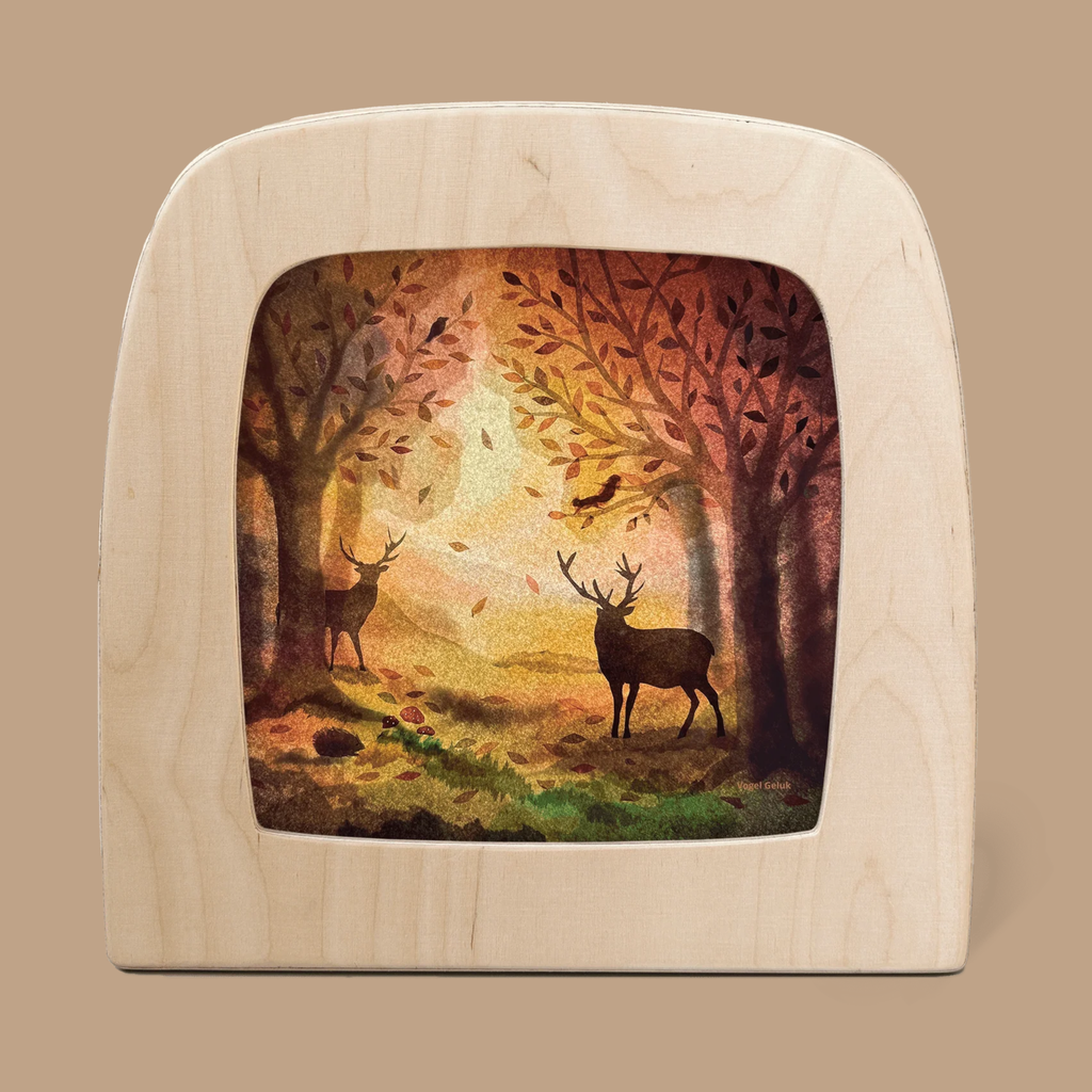 The Silhouette Only - Komorebi for Toverlux Lamp features two deer as magical silhouettes in an autumn forest, surrounded by colorful leaves, trees, and warm golden light. Ships in one week.