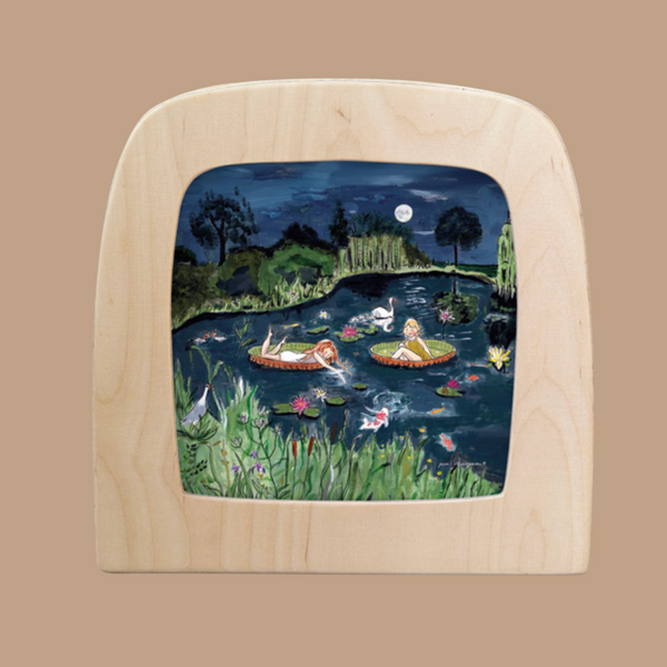 The "Silhouette Only - Magical Pond for Toverlux Lamp" features a serene night scene with two silhouetted figures relaxing on floating platforms in a moonlit pond, surrounded by water lilies, fish, and lush greenery beneath a starry sky.