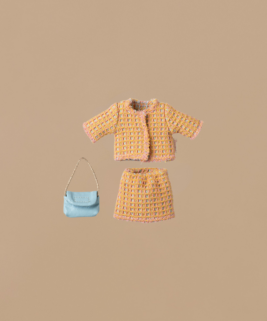 The Maileg Mom Mouse With Extra Outfit - Petite Couture, featuring a small tweed jacket and skirt in pastel colors, is displayed against a plain background. Accompanied by a miniature light blue handbag with a short strap, it echoes the charm of delicate Mouse Clothes.