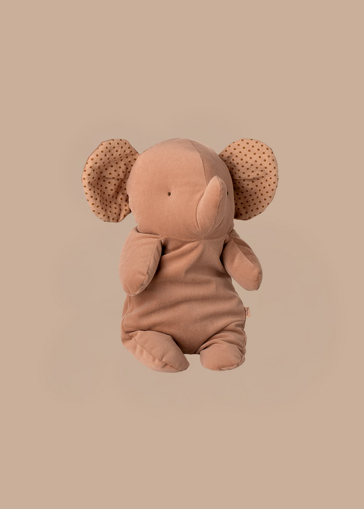 The Maileg Elephant Soft, Medium - Vintage Rose sits upright with large, polka-dotted ears, crafted from recycled polyester—an adorable addition to the Safari friends collection.