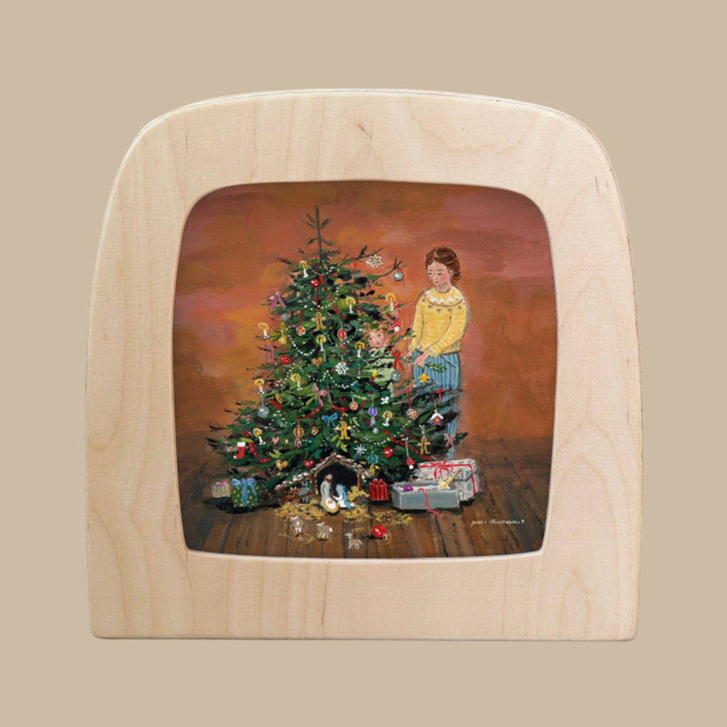 Silhouette Only - Tree Traditions for Toverlux Lamp: a charming scene of a girl decorating a Christmas tree with gifts and toys below, set in a wooden frame—ideal as home decor or to expand your Magic Silhouettes collection.