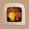 Displayed in a wooden frame, the whimsical illustration features the Little Lantern Silhouette as part of the Magic Silhouettes collection for the Toverlux Lamp. It depicts a charming gnome holding a lantern, surrounded by animals like a fox and rabbit beneath an autumn-leaf canopy, all set against a glowing yellow-orange background.