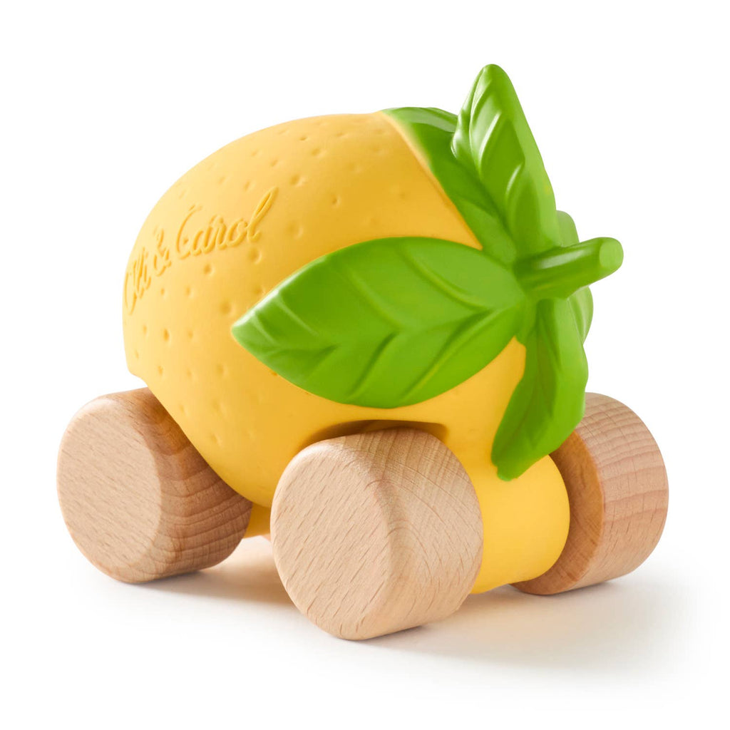 Lou The Lemon Baby Car features textured yellow skin and green leaves, mounted on four wooden wheels for eco-friendly, sensory-rich play.