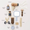 The Wooden Hairdresser & Barber Kit (ships in one week) is a plastic-free, wooden grooming set with barber tools like a hairdryer, mirror, razor, sea salt spray, shaving cream, scissors, clippers, styling wax, blades, and comb.