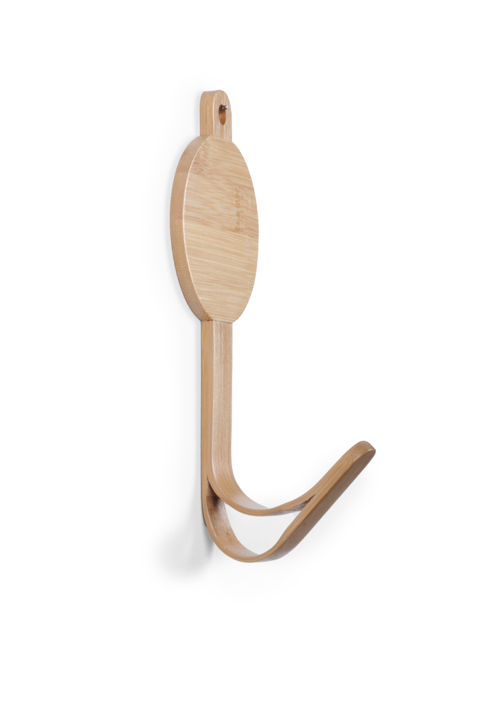 The Coat Hanger - Hedgehog features a wooden design with two curved arms and a rounded backplate, ideal for hanging coats or bags. Mounted on a white wall, it adds playful animal-themed decor to any space.