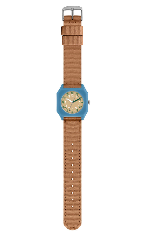 The Mini Kyomo Watch - Havana Sky features a light blue octagonal case, tan fabric strap, and beige dial with white numerals—perfect for kids learning to tell time with reliable Japanese movement.