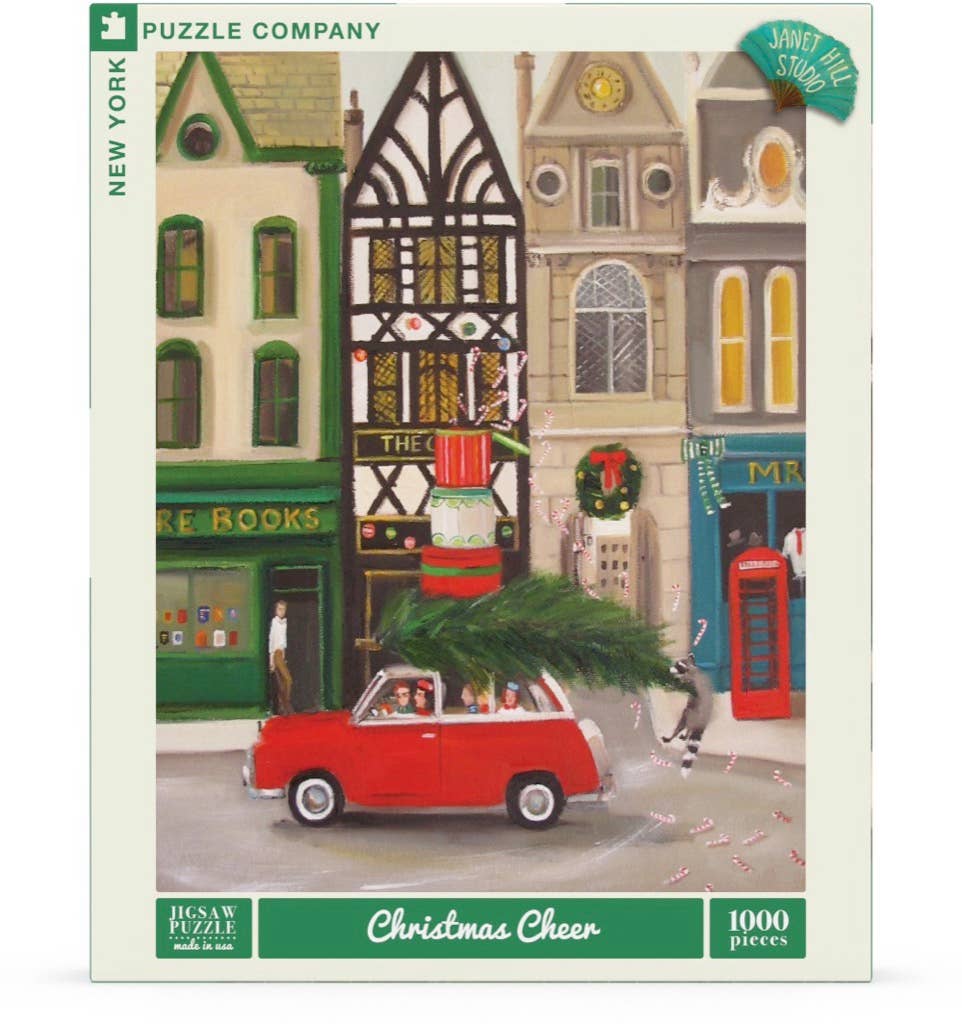 In the Christmas Cheer - 1000 Piece Jigsaw Puzzle, a red car with a Christmas tree on its roof drives past city buildings, a bookstore, a red telephone booth, and a raccoon standing on the street.