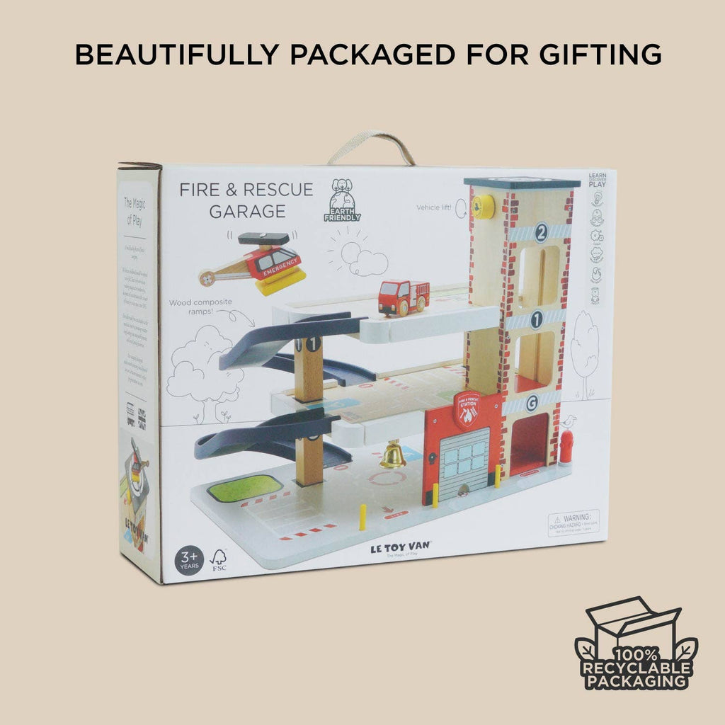 The Fire & Rescue Garage is a boxed wooden playset with ramps, fire engine toys, and accessories—beautifully packaged for gifting in 100% recyclable packaging.