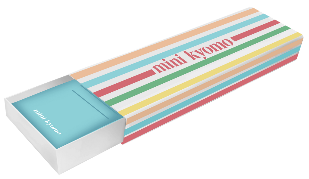 Rectangular box with pastel stripes and “mini kyomo” text, partially opened to show a light blue inner box—perfect packaging for the Mini Kyomo Watch - Blue Ocean, featuring Japanese movement.