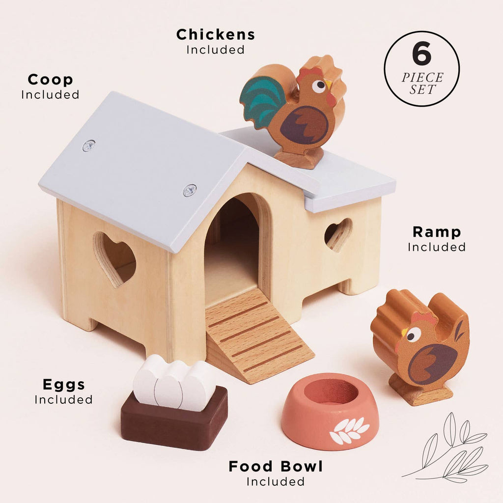 The Chicken Coop Playset is a delightful 6-piece farm toy made from FSC-certified wood, featuring a coop, two chickens, three eggs, a ramp, and a food bowl—all neatly organized for imaginative play.