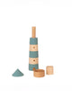 A Sabo Concept Lighthouse wooden toy with alternating blue and natural wood rings, shown stacked with extra loose pieces placed in front.