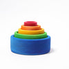 Grimm's Rainbow Stacking Bowls Blue to Red features five colorful wooden bowls, finished with a natural non-toxic stain, arranged by size—blue, green, yellow, orange, and red—on a plain white background.