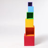Grimm's Large Set of Boxes - Rainbow features five hollow wooden stacking boxes in red, orange, yellow, green, and blue—perfect for creative play and non-toxic fun. They nest by size against a plain white background.