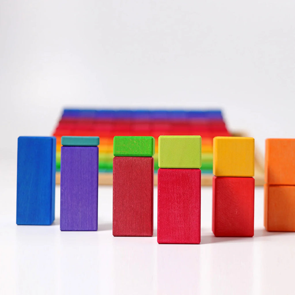 Grimm’s Stepped Counting Blocks - Large, featuring rainbow-colored wooden building blocks arranged in height-based columns.