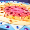 A Grimm’s Sparkling Mandala Sun Creative Puzzle featuring a circular wooden design in a mandala pattern with colorful geometric segments embedded with faceted jewels, perfect for developing fine motor skills.