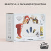The Groceries Set & Scanner is a wooden grocery playset made from FSC-certified wood, featuring toy food items, a red scanner, and a white basket in 100% recyclable, beautifully gift-ready packaging.
