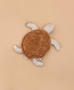 The Senger Naturwelt Cuddly Animal - Turtle, with a soft brown shell and beige flippers, made from organic cotton as a grain pillow, is displayed on a plain light brown background.
