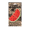 Wally the Watermelon Teether by Oli & Carol is a natural rubber baby teething toy shaped like a bright red watermelon slice with black seeds, featuring playful fruit illustrations and packaged on branded cardboard.