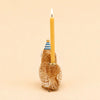 The Barn Owl Cake Topper—offered as a final sale item—is a handcrafted collectible ceramic figurine featuring an owl adorned with a blue-striped party hat and carrying a lit yellow candle on its back, photographed against a plain beige background.