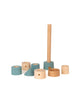 Sabo Concept Lighthouse stacking toy featuring a vertical rod on a base with assorted blue and natural wood pieces, designed for maritime adventure play.