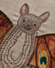 Close-up of the Coral & Tusk Bat Wing Surprise Pillow, showcasing detailed embroidery of a smiling brown bat with large ears and vibrant butterfly wings—an enchanting touch for whimsical Halloween decor or costume inspiration.