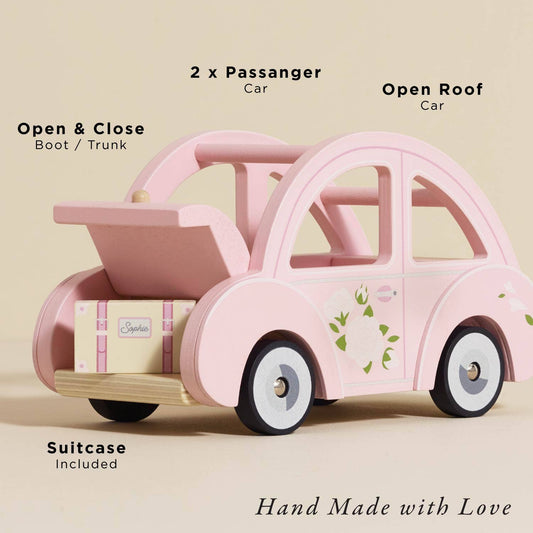 Sophie's Dolls House Toy Car: A pink retro wooden car with 2 seats, open roof, working boot/trunk, and suitcase included. “Hand Made with Love.” A delightful educational toy for little hands.