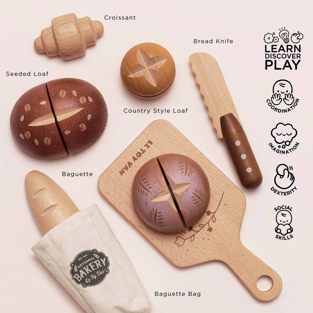 The Artisan Bread and Knife Set (ships in one week) includes a croissant, seeded loaf, country loaf, baguette, bread knife, and baguette bag—arranged with labels and educational icons for fun pretend kitchen play.