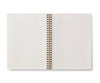 The Curio Spiral Notebook features ruled pages and blank white sheets in an open, spiral-bound design, shown from above on a white background.