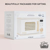A white box featuring the Wooden Microwave by Le Toy Van, crafted from sustainable wood. The packaging uses simple illustrations and text, perfect for play kitchens and comes in beautiful, recyclable gift-ready packaging. Ships in one week.