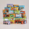 A vibrant stack of No. 11 GT65 Coco toy vehicle boxes arranged in a pyramid shape, each box featuring playful illustrations of cars, buses, and trains with unique names and eye-catching designs on a plain white surface—perfect for thoughtful gifting or sparking imaginative storytelling. Made in England.