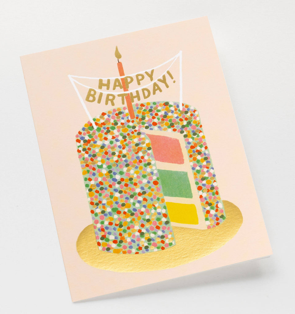 The Layer Cake Card features a tall, sprinkle-covered cake with colorful layers, gold foil accents, a lit candle, and a “Happy Birthday!” banner on a light background. Its blank interior is perfect for your personal message.