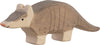 The Holztiger Armadillo is a handcrafted wooden toy, painted brown and gray with simple facial details, long tail, and short legs. Like all HOLZTIGER figures, it is made in Europe for quality and charm.