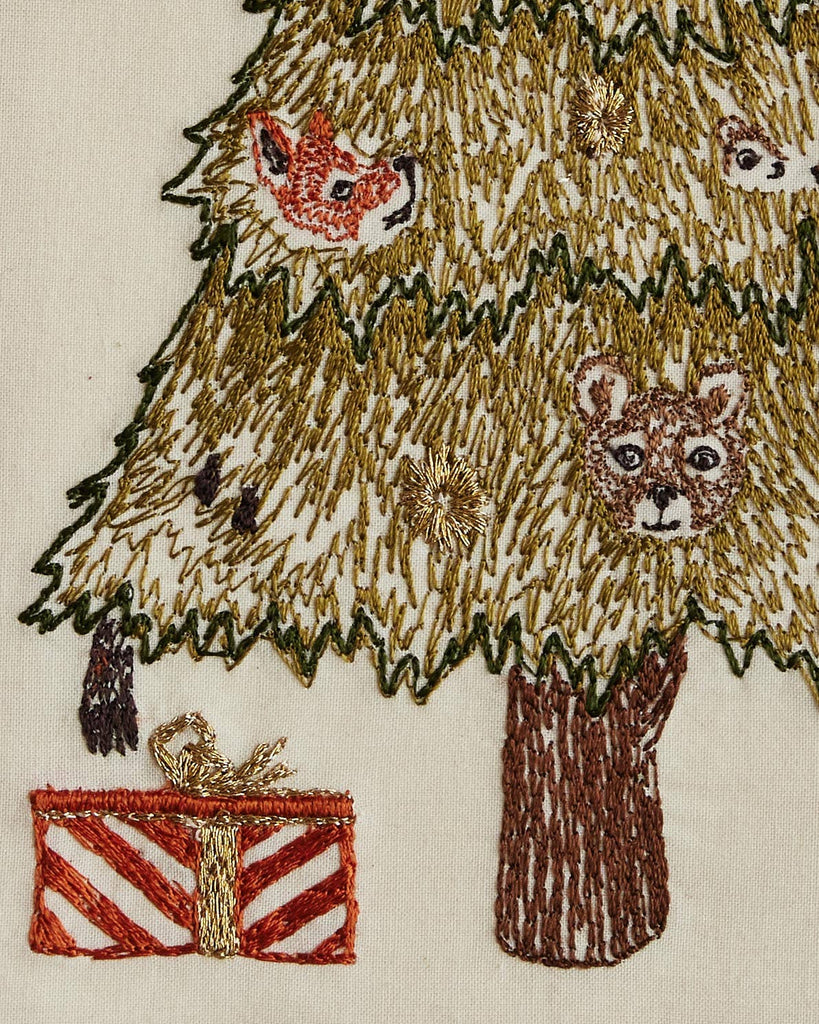 The Coral & Tusk Peek a Tree Card features an embroidered Christmas tree with gold details, woodland animals such as a fox and bear, and a festive red and gold striped gift at the base—making it a charming holiday keepsake.