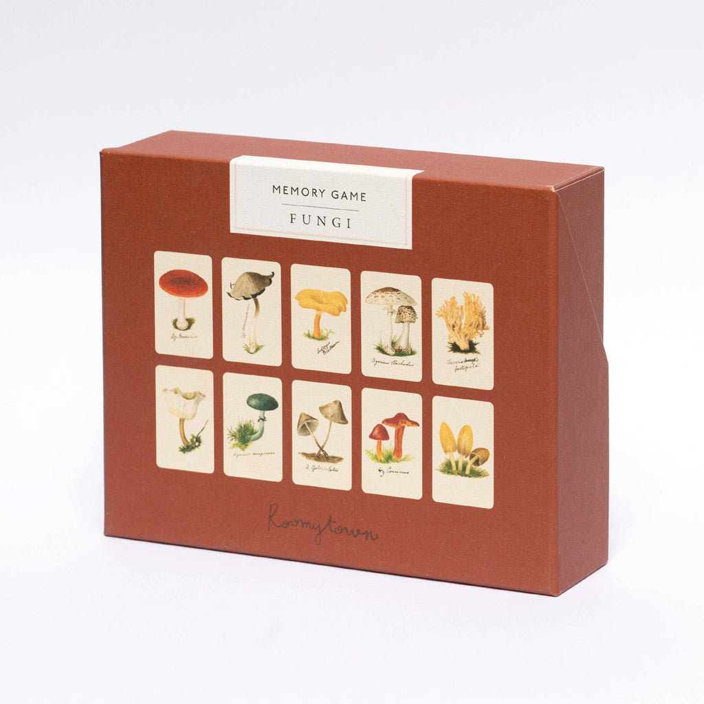 A brown box labeled "Memory Game - Fungi" features vintage illustrations of red, yellow, white, and coral-shaped mushrooms. The Fungi Matching Game is displayed against a plain white background.