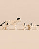 Holztiger Handmade Wooden Dalmatian Family Set featuring one adult dog and two puppies, each with painted black spots and ears.